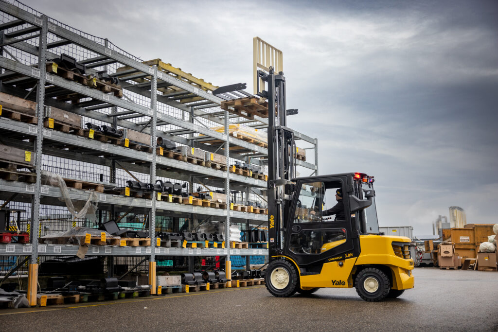 Yale forklift lifting pallets from an outdoor racking